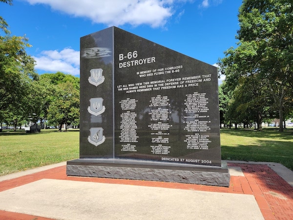 The B-66 Destroyer Memorial is crafted from polished black granite. It features engravings of Air Force seals and memorial information. The memorial is on display at the National Museum of the United States Air Force in Dayton, Ohio.