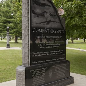 The Combat Skyspot Memorial is an upright monument rendered in black granite honors the veterans who performed the ground-directed air attacks. It features laser engraving of the attack aircraft and a dedication to those who served. The Combat Skyspot Memorial is located at the National Air Force Museum.