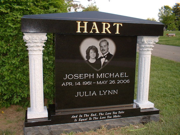 This Custom Companion Upright with Columns is crafted from polished black and white granite. It consists of a black upright with roof feature supported by 2 white columns. The memorial features a laser engraved image of the decedents and has an inscription of "And in the end, the love you take is equal to the love you make." This memorial is suitable for use with traditional interment or cremation.