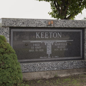 The Keeton Companion Family Mausoleum is crafted from speckled granite. It features a floral engraving in the memorial information panel and a photo of the decedents on the top center of the memorial. This mausoleum is appropriate for use with traditional interment or cremation.