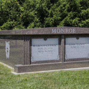 This Monroe Companion Family Mausoleum is crafted from Mahogany granite. It has a family crest engraved on the side. It is located at Rose Hill Cemetery in Mason, Ohio. This memorial is appropriate for use with traditional interment or cremation.