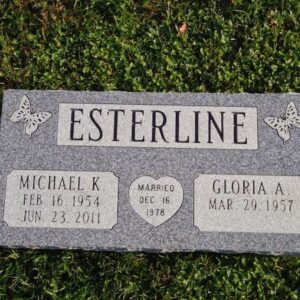 This Companion Flush Marker honoring Esterline is crafted from Rock of Ages gray granite. It features engravings of butterflies and a heart. This memorial is suitable for use with traditional interment or cremation.