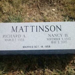 This Companion Bevel Marker honoring Mattinson is crafted from gray granite and reflects a cubist design. This memorial is suitable for use with cremation or traditional interment.