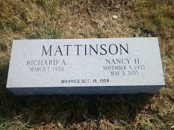 This Companion Bevel Marker honoring Mattinson is crafted from gray granite and reflects a cubist design. This memorial is suitable for use with cremation or traditional interment.