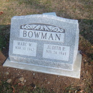 This Companion Slant Marker honoring Bowman is crafted from gray granite. It features an engraved scrollwork on the top portion of the stone. This memorial is appropriate for use with traditional interment or cremation.