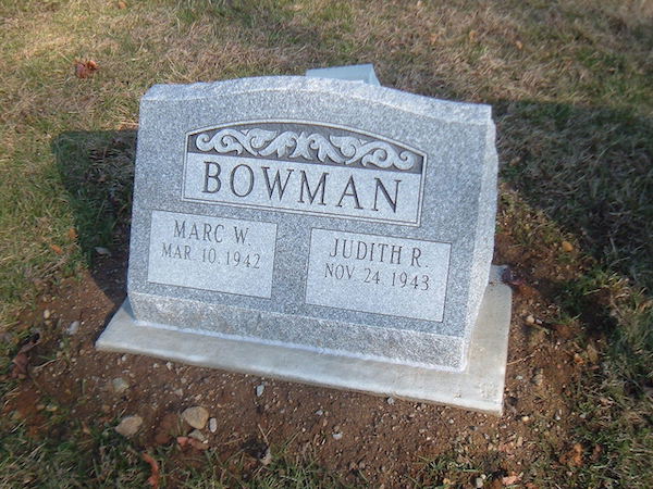 This Companion Slant Marker honoring Bowman is crafted from gray granite. It features an engraved scrollwork on the top portion of the stone. This memorial is appropriate for use with traditional interment or cremation.