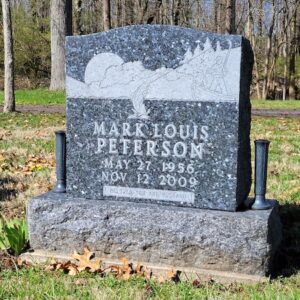This Single Upright with Fisherman is a monument with vases, crafted from Swedish Blue Pearl Granite and has an engraving of a fisherman. It is located at Sugar Grove Cemetery in Wilmington, Ohio. The memorial is suitable for use with traditional interment or cremation.