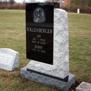 This Custom Companion Upright crafted from Black and Gray Granite is unique in its composition. It features a traditional polished black granite upright with a laser engraved image of the memorialized couple set in a rough gray granite base which surrounds two sides in an artistic manner. This memorial is appropriate for use with traditional interment or cremation.