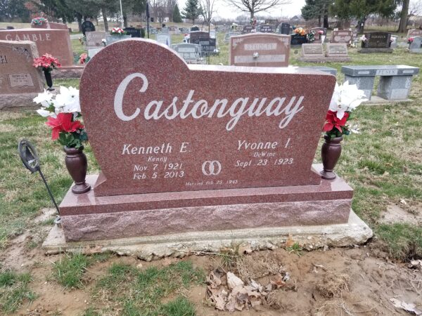 This Custom Double Heart Shaped Upright memorial, is rendered in India red granite and features an engraved cross and floral scrollwork. Contrast is provided with sawn finish on one heart and polished finish on the second heart. Located at Mt. Zion Park in Beavercreek, Ohio. It is suitable for cremation or traditional interment.