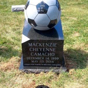 This Custom Single Upright with Soccer Ball sculpture is crafted from black polished and unpolished granite. The stone is installed on a black polished granite base with the memorialization information. This memorial is appropriate for use with cremation or traditional interment.