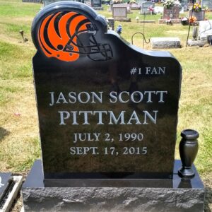 This Custom Single Upright with Bengals Helmet is crafted from black polished granite with orange highlights applied to the carving of the Cincinnati Bengals helmet. This monument features a stone carved and polished to accommodate the helmet carving and realistic colors. Appropriate for any Bengal's super fan and suitable for cremation or traditional interment.