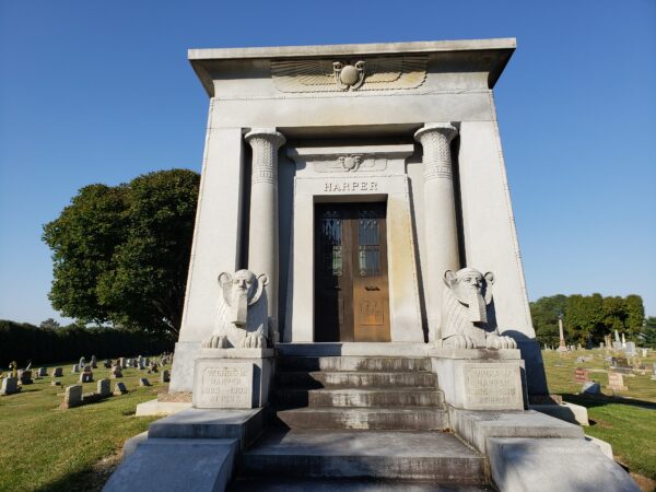 The Historic George Harper Mausoleum is crafted from gray granite and features a pair of sphinx sculptures guarding the vault.