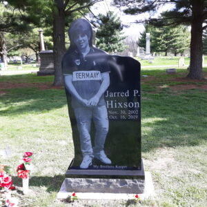 This Custom Single Upright with Standing image of the decedent was crafted from black polished granite. The photo realistic image was achieved using laser engraving. This memorial is suitable for use with cremation or traditional interment.