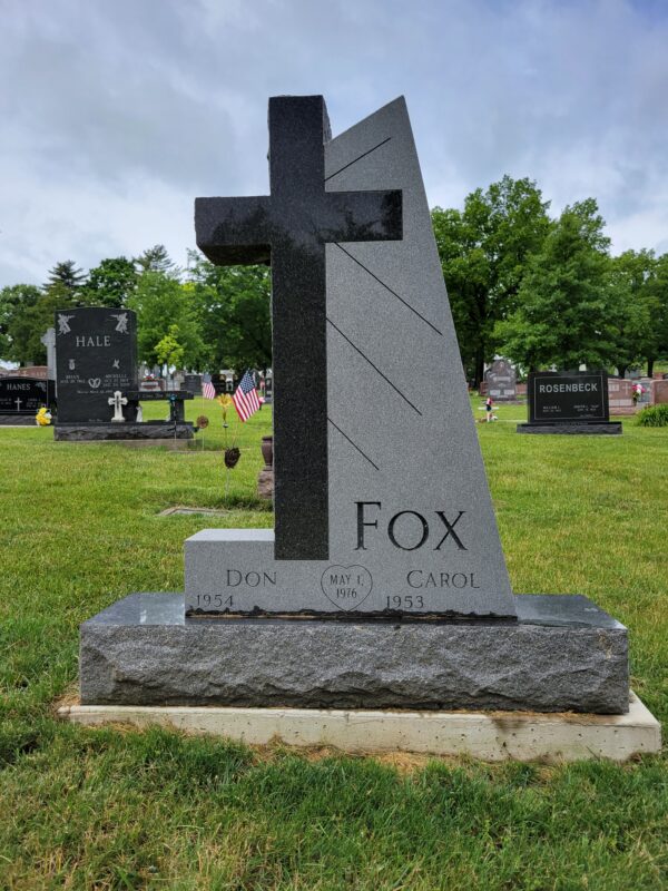 This Custom Companion Upright in Cross Shape memorial was crafted for two people at the Calvary Cemetery in Dayton, Ohio. It was carved out of Rock of Ages Midnight black granite. This memorial is suitable for traditional interment or cremation.