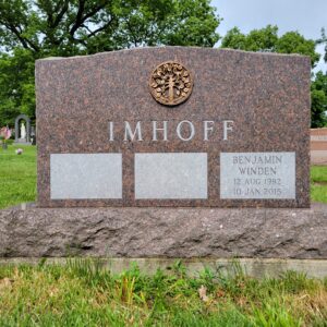 This Companion Upright with Bronze Medallion memorial crafted for the Imhoff family is located at the Calvary Cemetery in Dayton, Ohio. It is for three family members and has a custom bronze medallion. The granite used is Carnelian Mahogany and is quarried in the USA. It is suitable for traditional interment or cremation.