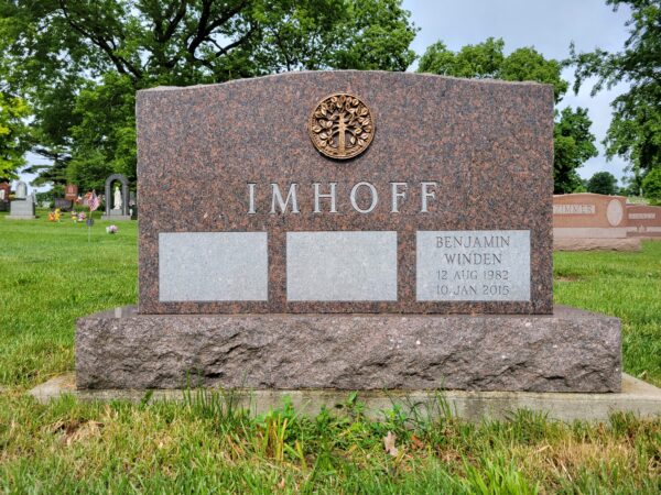 This Companion Upright with Bronze Medallion memorial crafted for the Imhoff family is located at the Calvary Cemetery in Dayton, Ohio. It is for three family members and has a custom bronze medallion. The granite used is Carnelian Mahogany and is quarried in the USA. It is suitable for traditional interment or cremation.