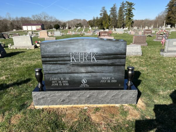 This Companion Memorial with Beach Laser Engraving memorial was crafted from Black Ultimate granite for the Kirk family. This memorial is located at Morrow Cemetery in Morrow, Ohio. It is appropriate for use with traditional interment or cremation.