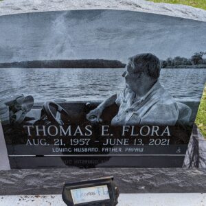 This Single Laser Upright with Boat laser engraving has a photo realistic depiction of the decedent on the water. Crafted in polished black granite, this memorial is suitable for use with cremation or traditional interment.
