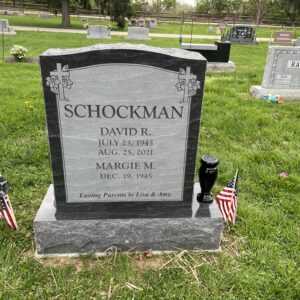 This Companion Upright with Dual Cross Carvings memorial with stacked names was crafted from Rock of Ages Black Mist granite for the Schockman family. It is located at Evergreen Cemetery in Miamiville, Ohio. It is suitable for use with cremation or traditional interment.
