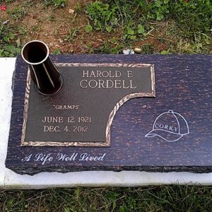 This Single Bronze Marker with Vase is resting on a Cats Eye Brown marker. It is located at Glen Forest Cemetery in Yellow Springs, Ohio. It also includes a single vase. This memorial is appropriate for use with traditional interment or cremation.
