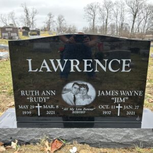 This companion upright laser engraved memorial was crafted from black, polished granite and features a laser engraving of the couple the marker memorializes. This memorial is appropriate for traditional interment or cremation.