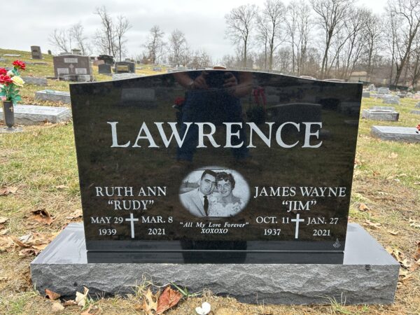 This companion upright laser engraved memorial was crafted from black, polished granite and features a laser engraving of the couple the marker memorializes. This memorial is appropriate for traditional interment or cremation.