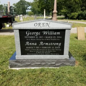 This companion upright memorial created from Black Ultimate, Newbury Gray granite is placed Greenlawn cemetery. It is appropriate for one or multiple people who have been cremated and interred.